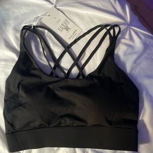 Brand is HALARA, size small, sports bra, black